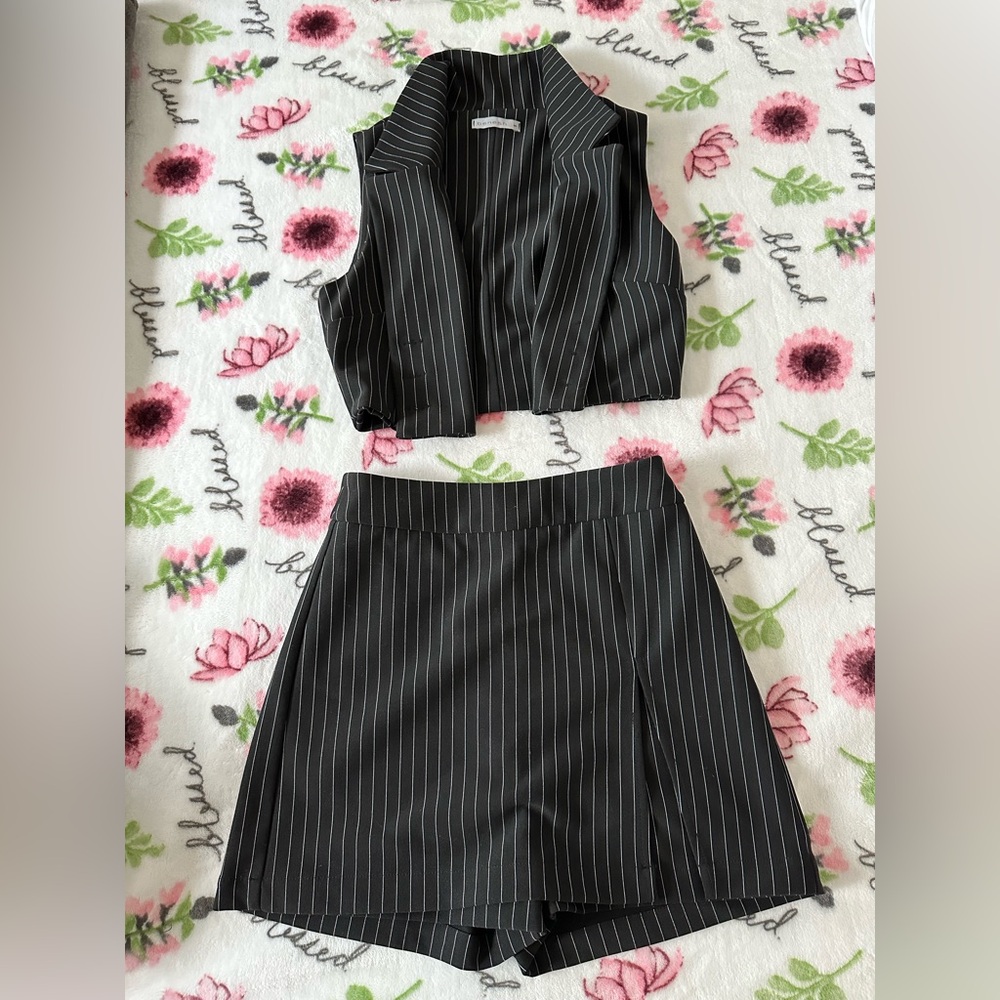 New, never used set - vest and skort.